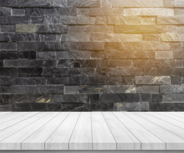 деревянная доска с абстрактным размытием черного камня кирпичная стена фон для отображения продукта