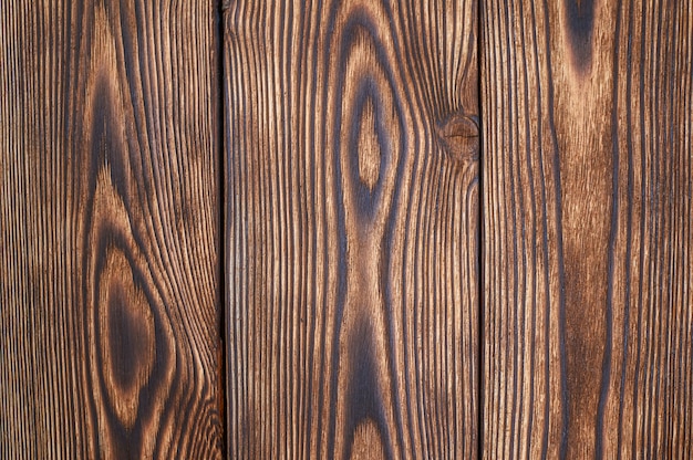 Bello modello e struttura marroni delle plance di legno per fondo