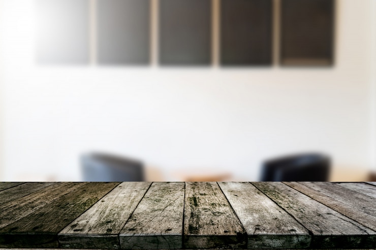 Photo wood shelf with coffee shop blurred background 
