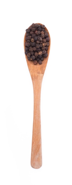 wood spoon of black pepper isolated on white background