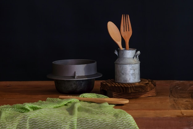 Wood spoon and fork in cup 