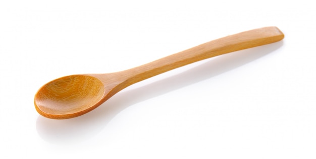 Photo wood spoon on white space