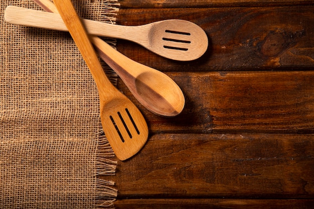 Wood spoons on wooden table. Top view.