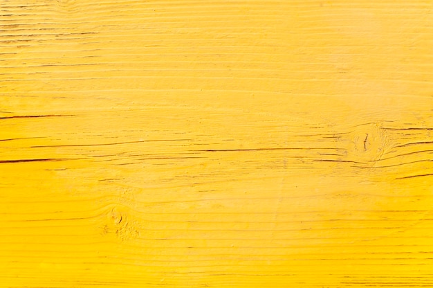 wood surface with yellow color paint