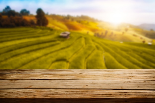 Wood table in autumn landscape with empty copy space for product display