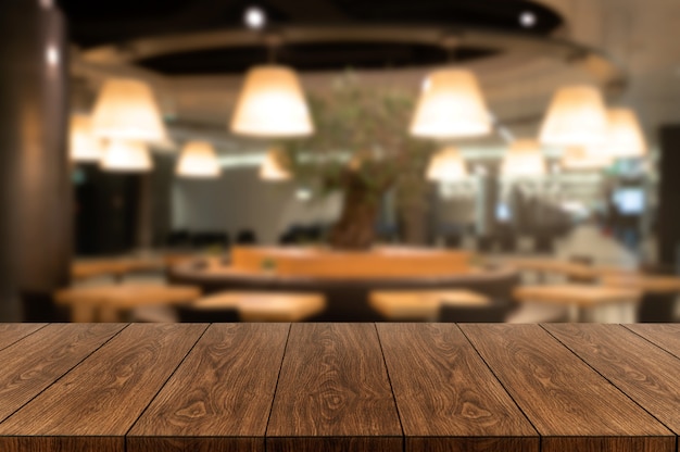 Photo wood table in blur background of modern restaurant