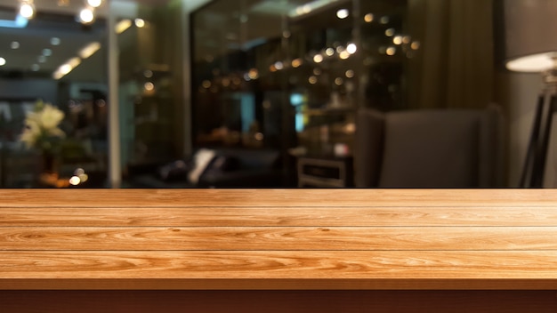 Wood table in blur background of modern restaurant