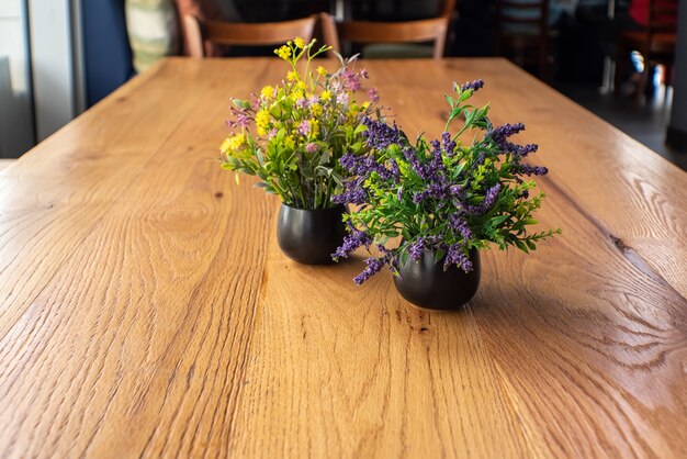 Wood table on blur of cafe coffee shop bar