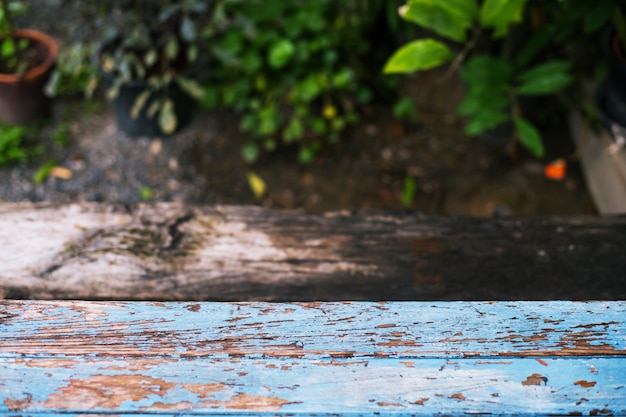 Wood table on blur of garden background