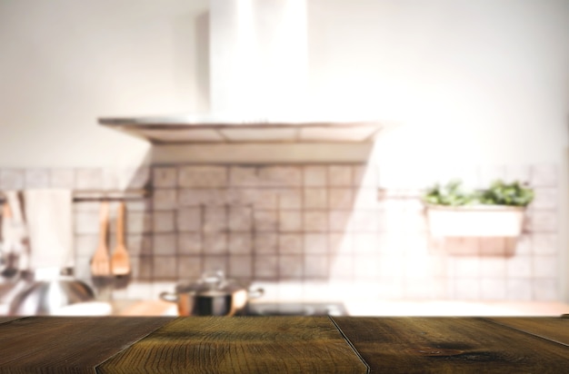 Wood table on blur Interior of kitchen background