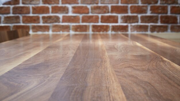 Wood table and brick wall background