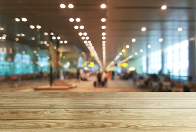 Wood table in conference hall background with empty copy space for product display