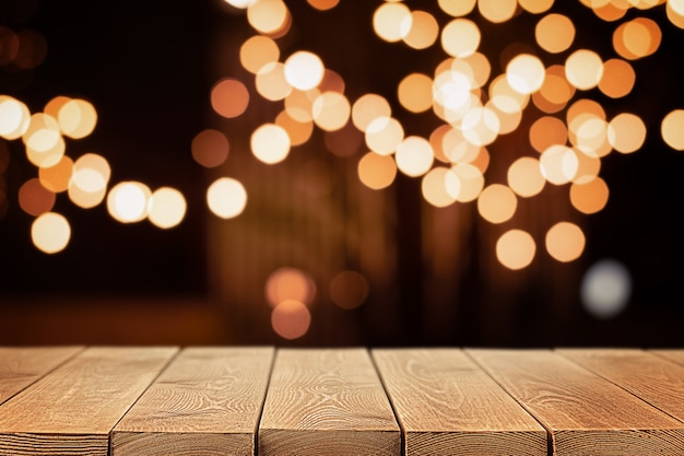 Wood table in the foreground and gold defocus lights in the background, background with copy space