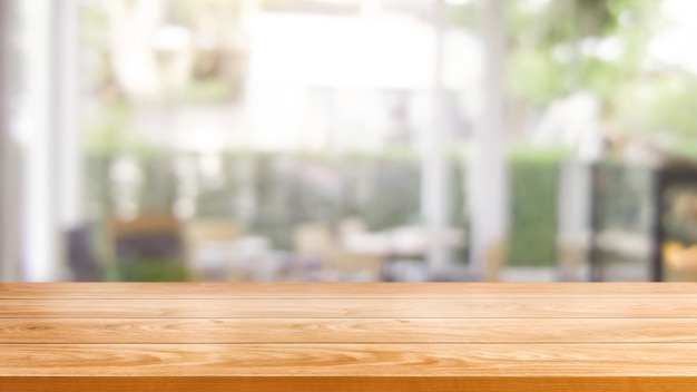 写真 モダンなレストランの背景をぼかしの木製テーブル