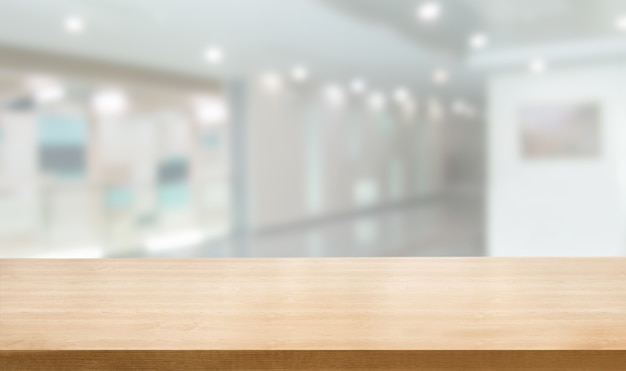 Wood table in modern hospital interior with empty copy space on the table for product display