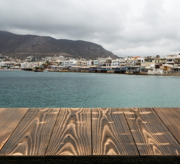 Wood table outside with seaview in beautiful summer day