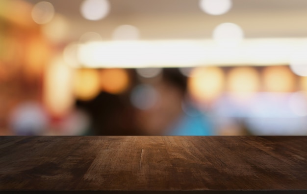 Wood Table Top in Blur Background room interior with empty copy space.