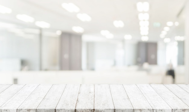 Wood table top and blurred bokeh office interior space background