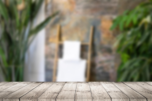 Wood table top on blurred green background - can be used for montage or display your products