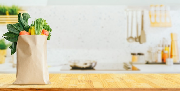 Wood table top on blurred kitchen background