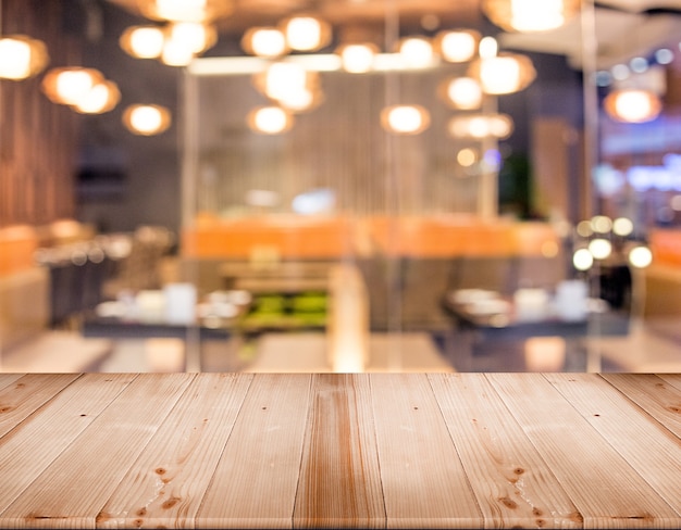 wood table top for display product with blur restaurant