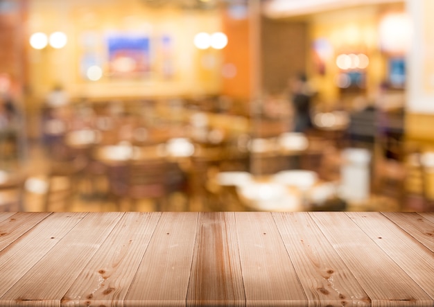 wood table top for display product with blur restaurant