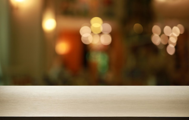 抽象的なぼやけた背景の前に木製のテーブル トップ テキスト マーケティング プロモーション空白の木製テーブル表面コピー スペースの空の木製テーブル スペース
