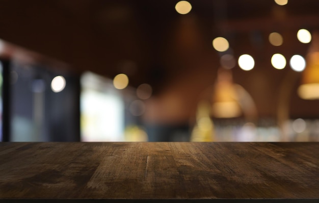 Wood table top in front of abstract blurred background Empty wooden table space for text marketing promotion blank wood table surface copy space