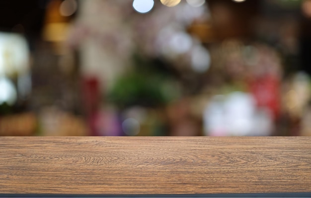 Wood table top in front of abstract blurred background Empty wooden table space for text marketing promotion blank wood table surface copy space