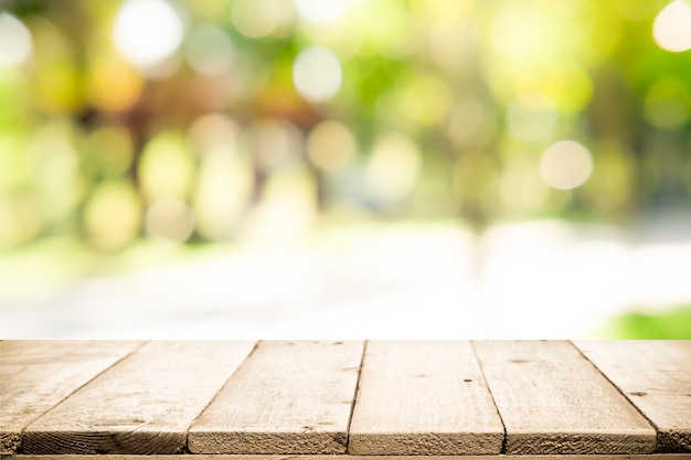 Wood table top on green nature background