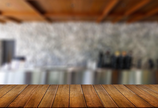 Wood table with blur in coffee shop cafe for montage product\
display table copy space cafe background with copy space for\
text