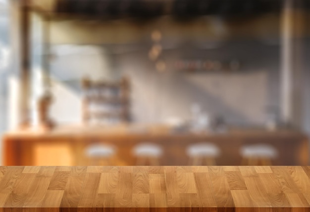 コーヒーショップカフェのぼかしのある木製のテーブルモンタージュ製品の表示テーブルのコピースペースカフェの背景とテキストのコピースペース