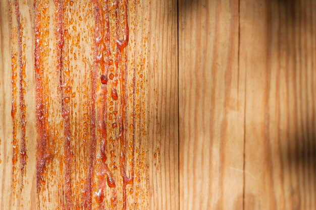 wood texture background with space and natural resin drops
