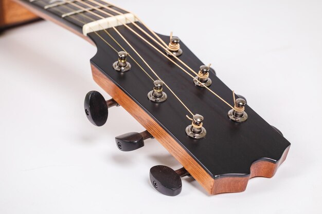 Photo wood texture of lower deck of six strings acoustic guitar on white background guitar shape