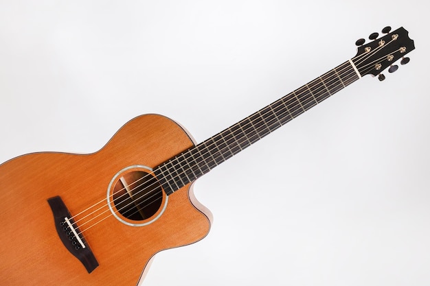 Photo wood texture of lower deck of six strings acoustic guitar on white background guitar shape