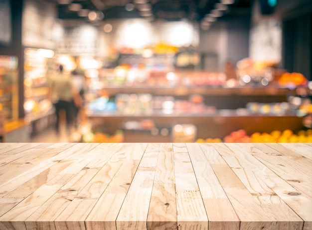 Photo wood texture table top with blur grocery, market store