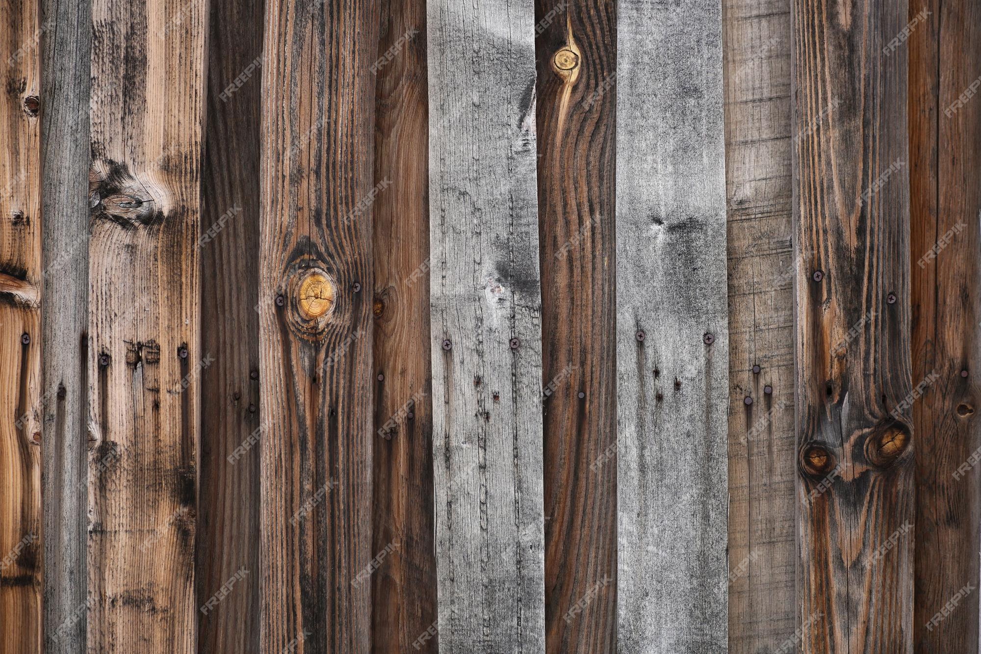 Premium Photo | Wood texture wallpaper background, vintage darkened fence.  gray and brown boards with rusty nails. high quality photo