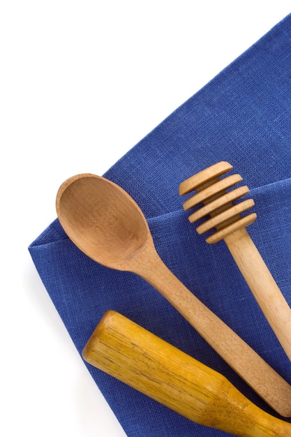 Wood utensils at table napkins isolated on white background