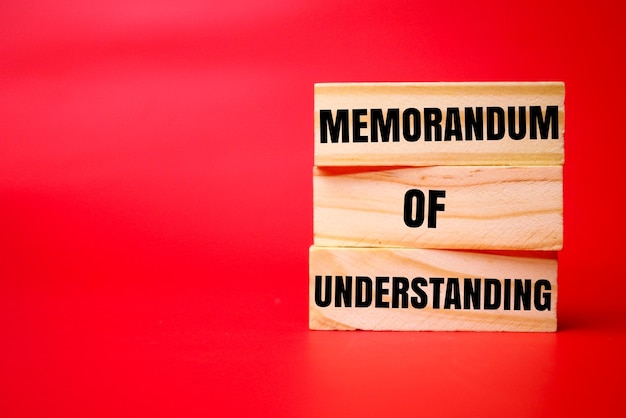 wood with the words memorandum of understanding memorandum of understanding concept