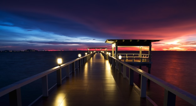 Wooded bridge in the beach island portalong the sunset time