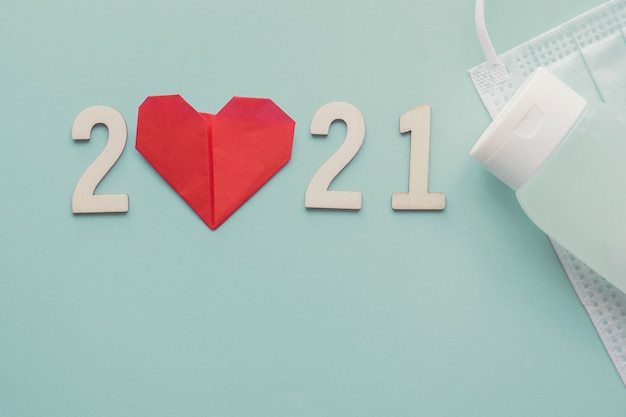 Photo wooden 2021 number with red heart paper