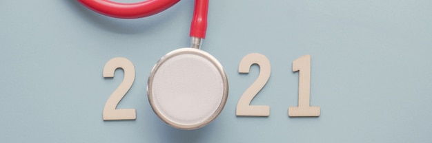 Photo wooden 2021 number with red stethoscope