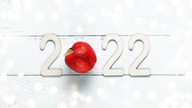 Photo wooden 2022 numbers on white background minimal concept of xmas and new year