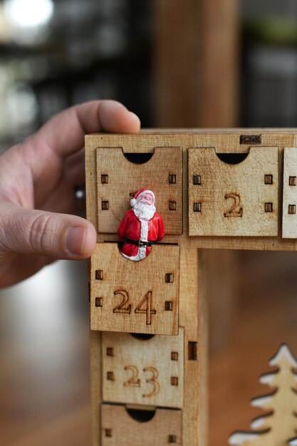 A wooden advent calendar with Santa Claus