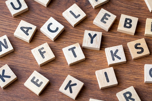 Wooden alphabet on the wooden table