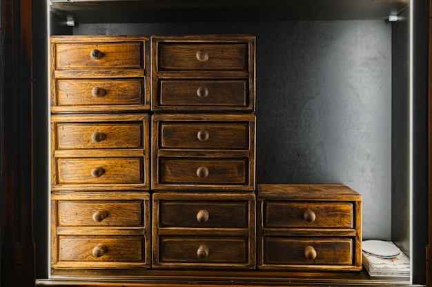 Photo wooden antique drawer standing on top of each other.