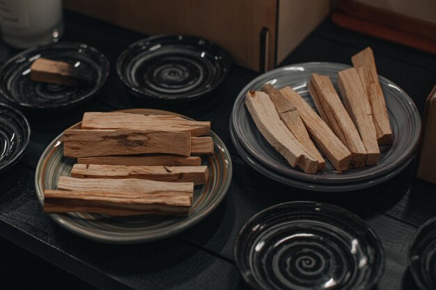 Wooden aroma organic sticks on ceramic plates relaxation and aromatherapy concept
