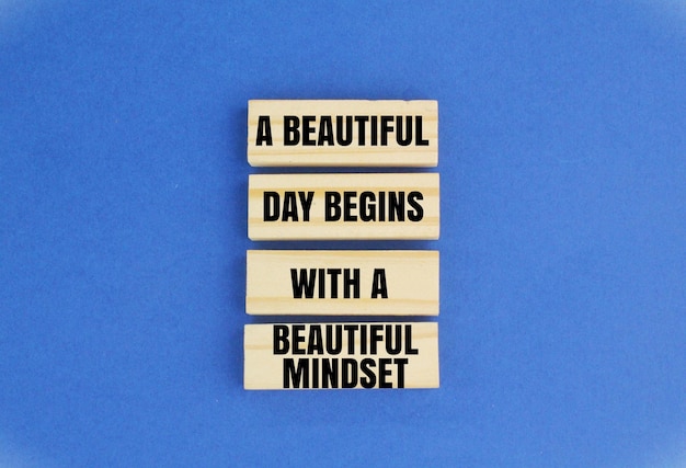 Photo wooden arrangement with words a beautiful day begins with a beautiful mindset concept of open mind