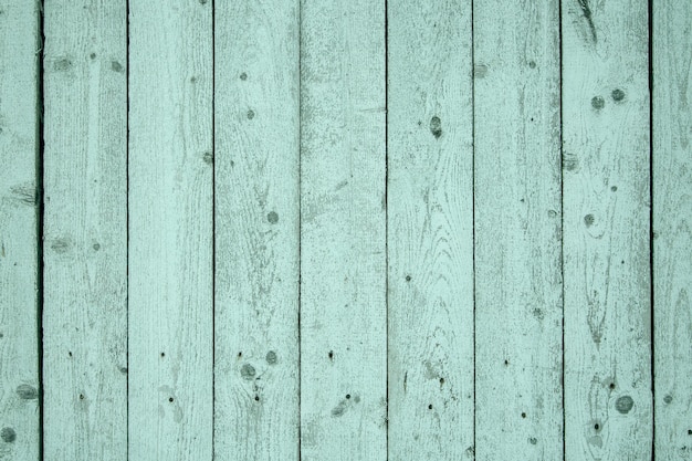 Wooden background from light green painted boards. Wood texture.