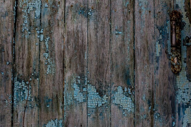 Wooden background of the old wooden planks with remnants of blue